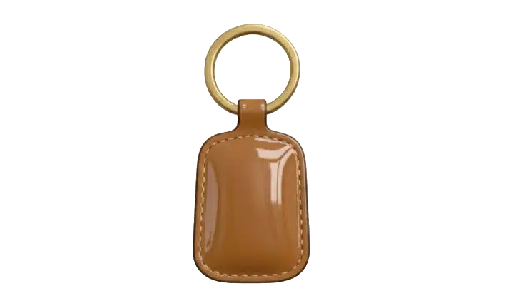 A close-up of a brown leather automotive keychain on a white background, showing its texture and stitching details.