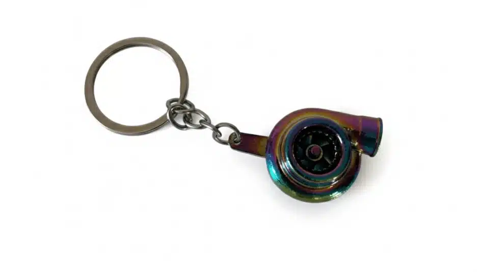 A close-up shot of a coloured turbo keychain with a small spinning turbine.