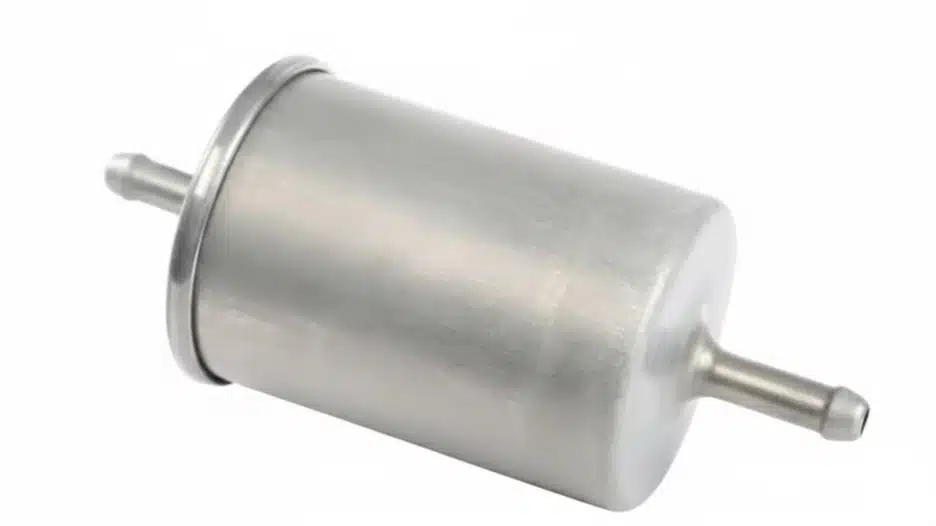A new, metallic cylindrical fuel filter with input and output nozzles.