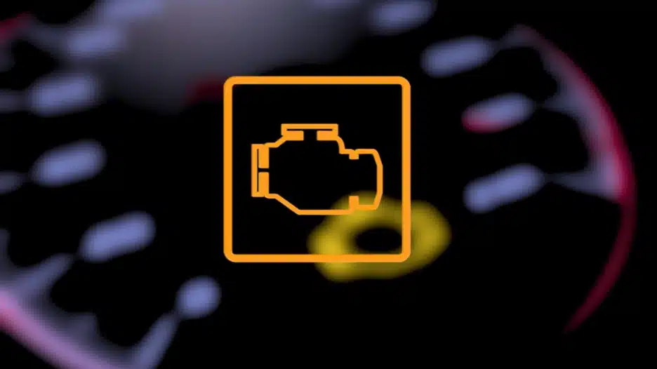 Orange check engine warning light illuminated on a car dashboard, indicating an engine or emissions system fault.