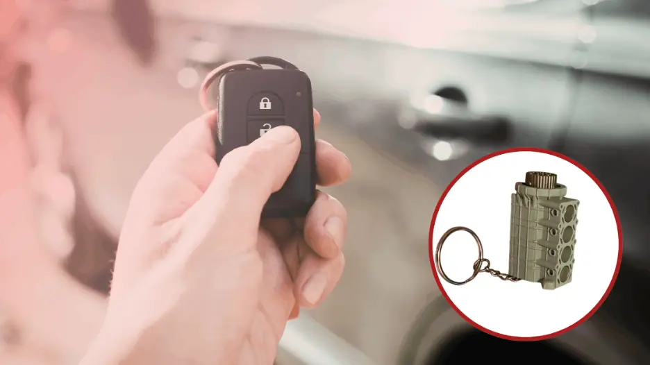 Hand holding a car key fob next to a detailed 4-cylinder engine keychain with moving pistons, designed for car enthusiasts and automotive lovers.