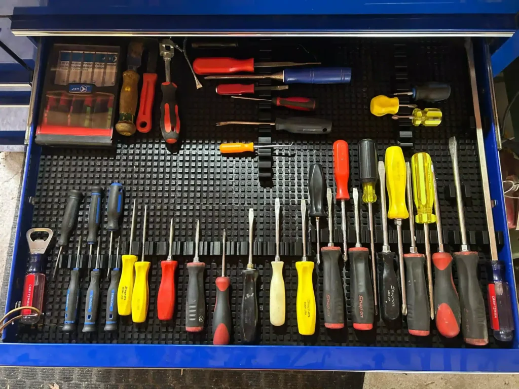 Automotive Accessories NA Screwdriver Products. Shows the Tool Mat System with Large, Medium, and Small Magnetic Screwdriver Attachments.
