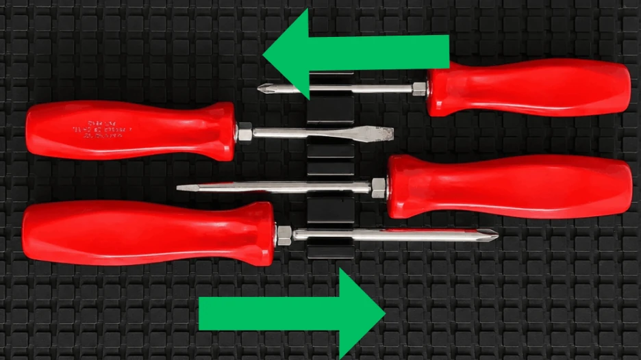 Magnetic screwdriver clips securely holding screwdrivers in place on a modular toolbox organizer.